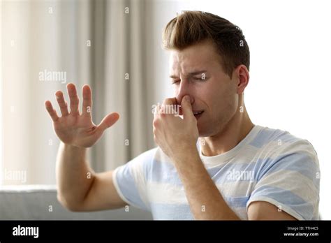 Hand Pinching Nose Hi Res Stock Photography And Images Alamy