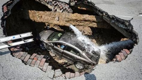 Video Ohio Woman Rescued After Car Falls Into Massive Sinkhole