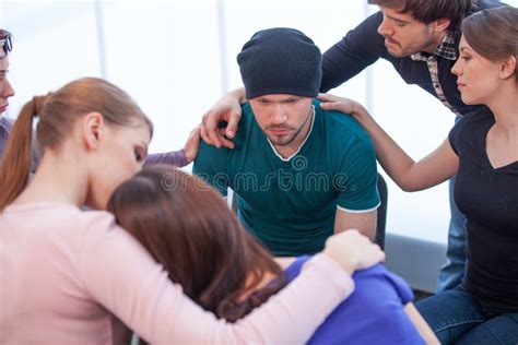 Several People Comforting Young Man On Background Royalty Free Stock