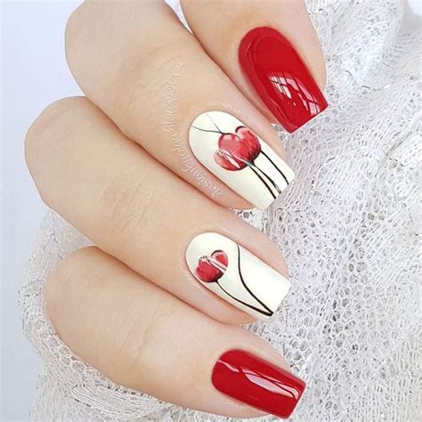 Diseños de uñas realizados sobre un fondo de esmalte negro, realizaremos encima los dibujos de decorados de uñas, con la ayuda de pinceles finos y esmaltes blancos e rojos, decoracion de uñas paso a paso. UÑAS DECORADAS CON FLORES Diseños Sencillos y Elegantes