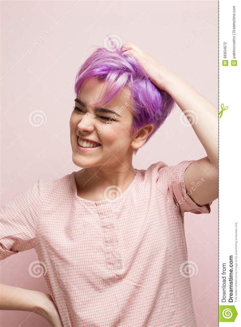 Violet Short Haired Woman In Pink Pastelholding Her Hair With O Stock