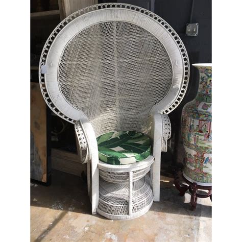 A wicker chair woven out of white twigs, perfect for sitting around the house and enjoying the serenity. Vintage Large White Wicker Peacock Chair | Chairish