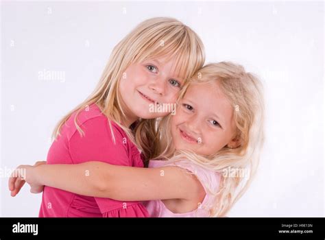 Two Happy Blonde Girls Hugging Stock Photo Alamy