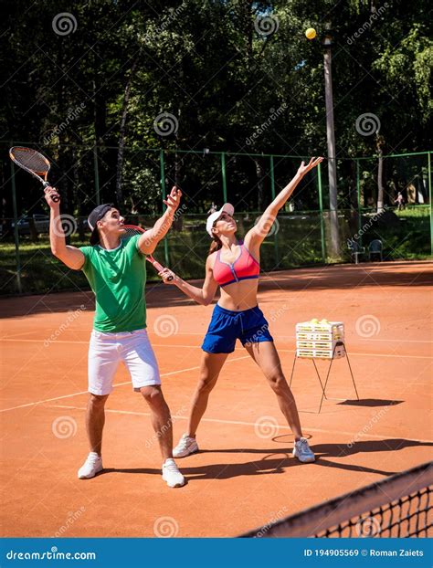 Young Athletic Woman Playing Tennis With Her Coach Stock Image Image Of Game Athlete 194905569