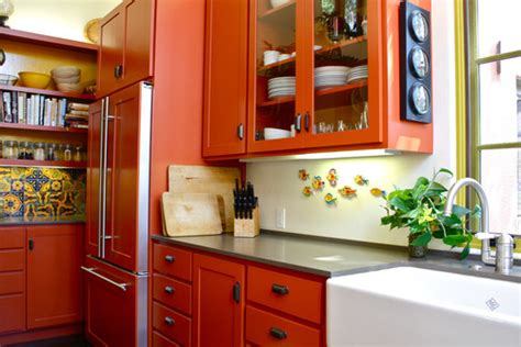 Orange walls with brown & tan furniture & hardwood floors. Beautifully Colorful Painted Kitchen Cabinets