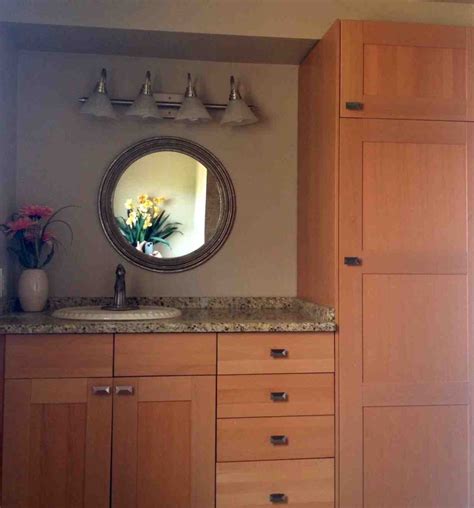 A combination of white painted cabinetry and rustic hickory cabinets create an earthy and bright kitchen. Using Kitchen Cabinets in Bathroom - Home Furniture Design