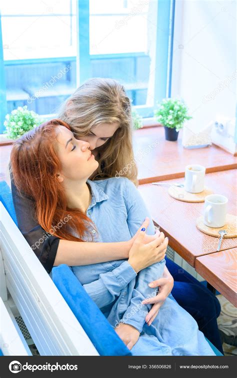 Two Lesbian Women Hugging While Sitting In A Cafe Relations Of The Same Sex The Proximity And
