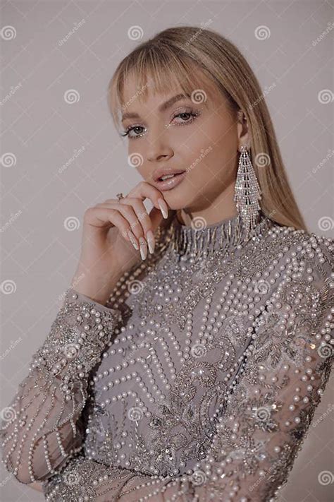 Close Up Attractive Tempting Blonde Woman In Diamond Earrings Pose In
