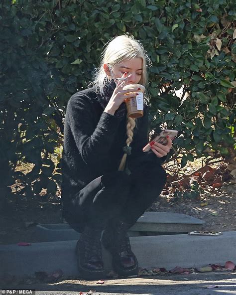 Anya Taylor Joy Perches On The Pavement To Smoke A Cigarette Daily