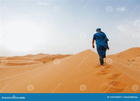 Arab Man Climbing A Desert Dune On The Desert Editorial Photography