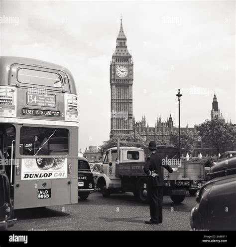 1960s historical british policeman directing traffic at parliament square london england