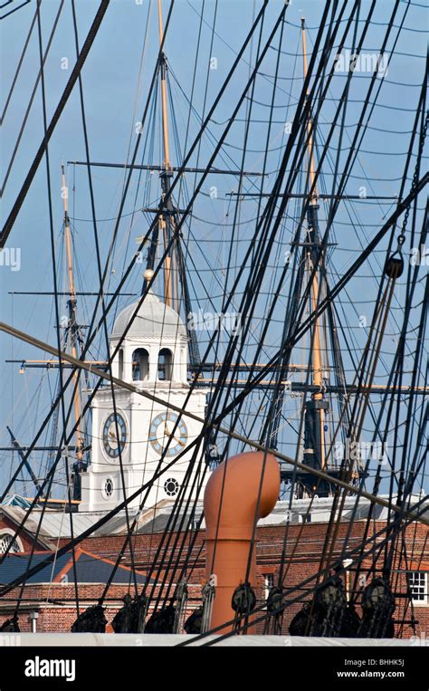 Looking Through The Rigging Of Hms Warrior With Hms Victory In The