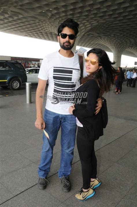 riya sen and husband shivam tewari hug and pose for cameras at airport