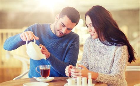 Happy Couple Drinking Tea At Cafe Stock Image Image Of People