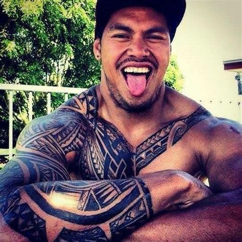 A Man With Tattoos On His Arms And Chest