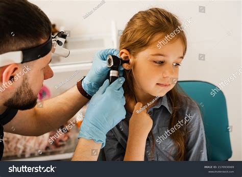 Ent Doctor Otolaryngologist Looks Through Otoscope Stock Photo
