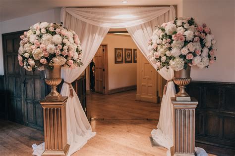Gold Urn Entrance Wedding Pedestals Dusky Pink And Ivory Flowers