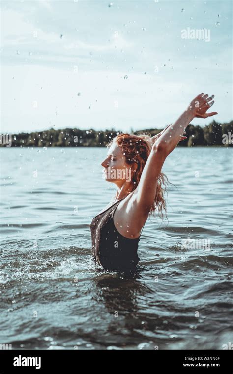 Young Beautiful Woman Standing In The Water Black Swimsuit Vintage Style Vertical Photo Stock