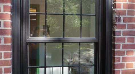 Man painting window frame at home, closeup. Can You Paint Vinyl Windows | How to Paint Vinyl Windows