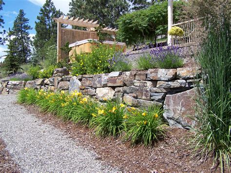 Landscaping with a dry stream and using river rock to accent your garden. Natural Large Rocks For Landscaping - HomesFeed