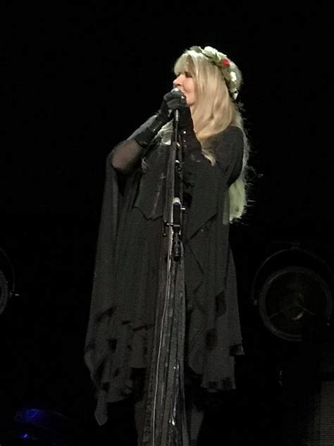 Clear vase of white oriental lilies and seeded eucalyptus. Stevie ~ ☆♥ ♥☆ ~ onstage wearing a crown of flowers during ...
