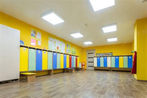 Yellow Colored Changing Room And Lockers Of Kindergarten For Children