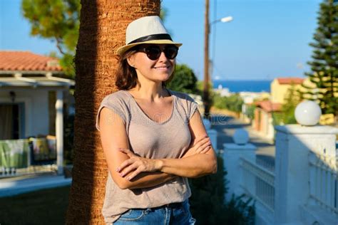 portrait of mature beautiful smiling woman on vacation summer tropical landscape stock image