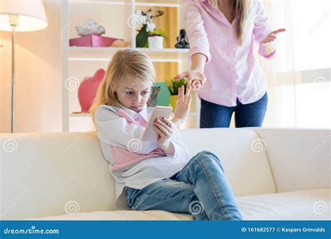 Mother Asking Girl About Homework Royalty Free Stock Image 19999684