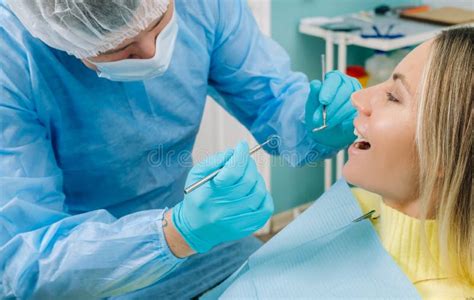 The Patient Treats Her Teeth At The Dentist In The Dental Office Dental Fillings Stock Image