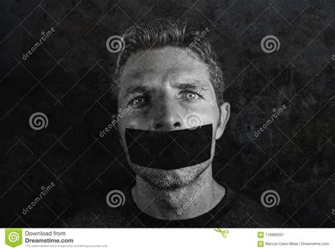 Young Man With Mouth And Lips Sealed Covered With Adhesive Tape In Censorship Coerced Freedom Of