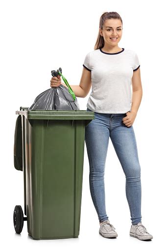 Young Girl Throwing Out The Garbage Stock Photo Download Image Now