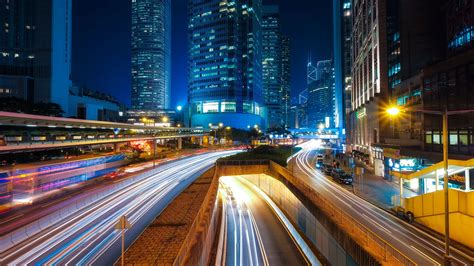 Lighted Up Roads At Night With Skyscrapers In Hong Kong China Image