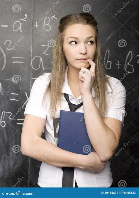 Cute Young Student Near Blackboard With Copy Book Calculator Pen Copy