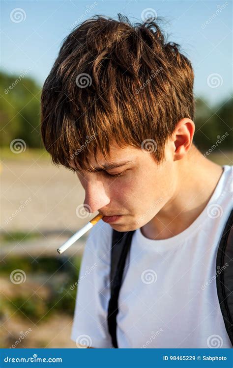 Young Man With A Cigarette Stock Image Image Of Confused 98465229