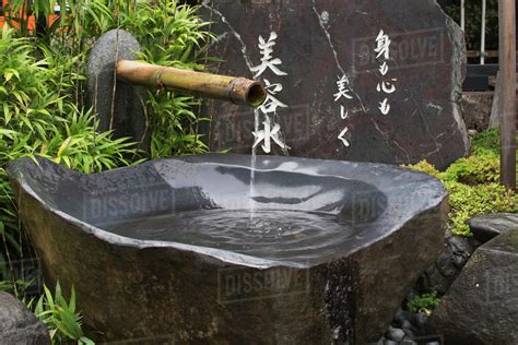 Grey Stone Water Fountain At A Japanese Temple Kyoto Japan Stock