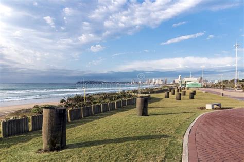 Beachfront Promenade Sea And Ocean Against Blue City Skyline Stock