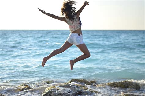 Wallpaper Ocean Beach Girl Hair Jump Jumping Model Sand Rocks