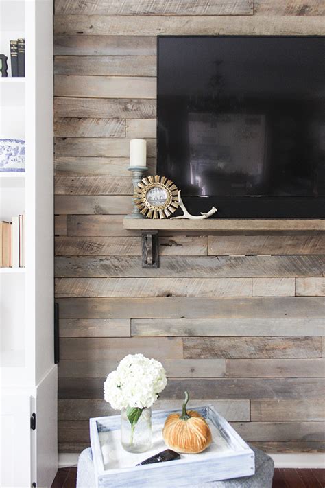 The black accent wall is very impressive, as a raised geometric pattern was created using very thin pieces of wood, before it was all painted. How to Build a Pallet Accent Wall