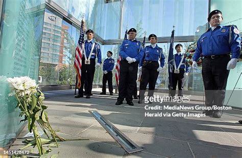Boston Mamembers Of The Tsa Honor Guard Stand Next To Glass Panels