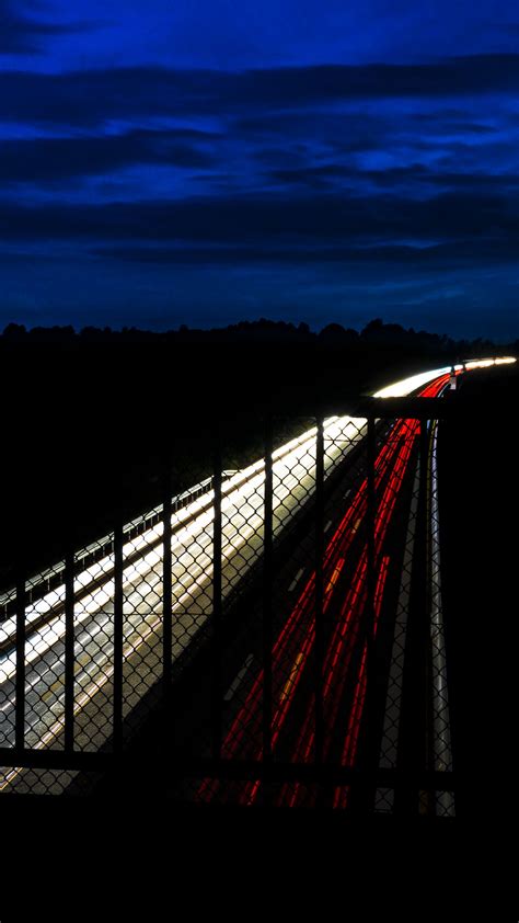 Download Wallpaper 2160x3840 Highway Night Bridge Road Light