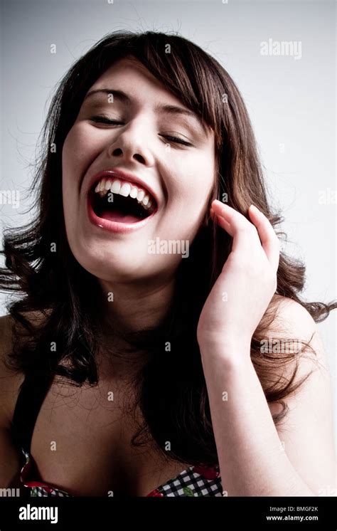 Young Girl Laughing With Mouth Open Stock Photo Alamy