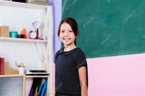 Premium Photo School Curriculum Happy School Girl In Classroom Back To School Forms Of