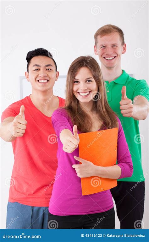 Happy Students Showing Thumbs Up Sign Stock Image Image Of Folder