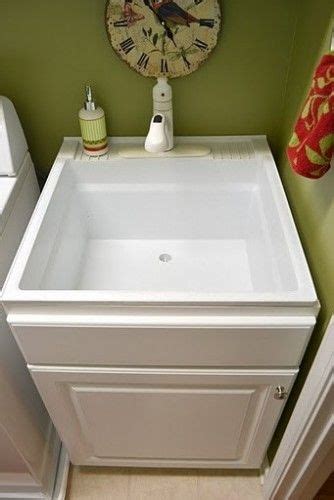Search for utility sinks with cabinets. Less pricey sink disguised Build a cabinet box around ...