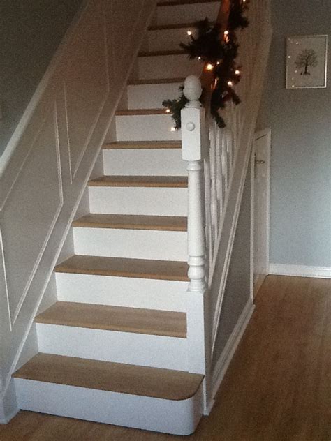 These clever storage and organization and home improvement projects will take your steps to the next level. Oak and white painted stairs. Wrapped bannister with lit ...