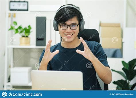 Young Man Study In Front Of The Laptop Computer At Home Stock Photo
