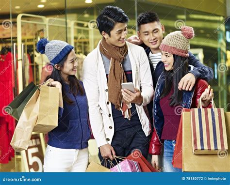 Young Asian Couples Enjoying Shopping In Mall Stock Photo Image Of