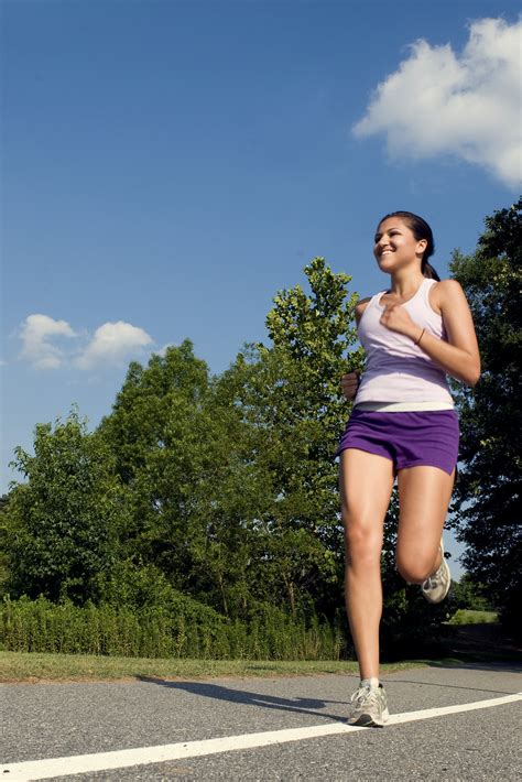 Exercise Women Free Stock Photo A Young Woman Jogging Outdoors