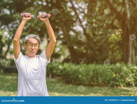Mature Man Lifting Dumbbell In Park Stock Image Image Of Activity