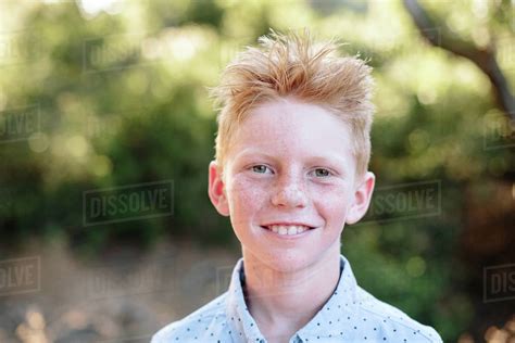 Portrait Outside Of A Red Haired Boy With Freckles Stock